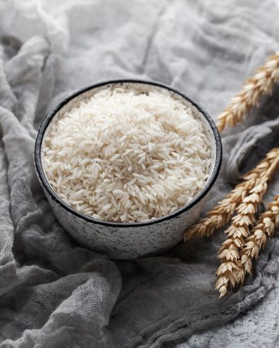 bowl-with-rice-grains-assortment-high-angle_23-2149359449